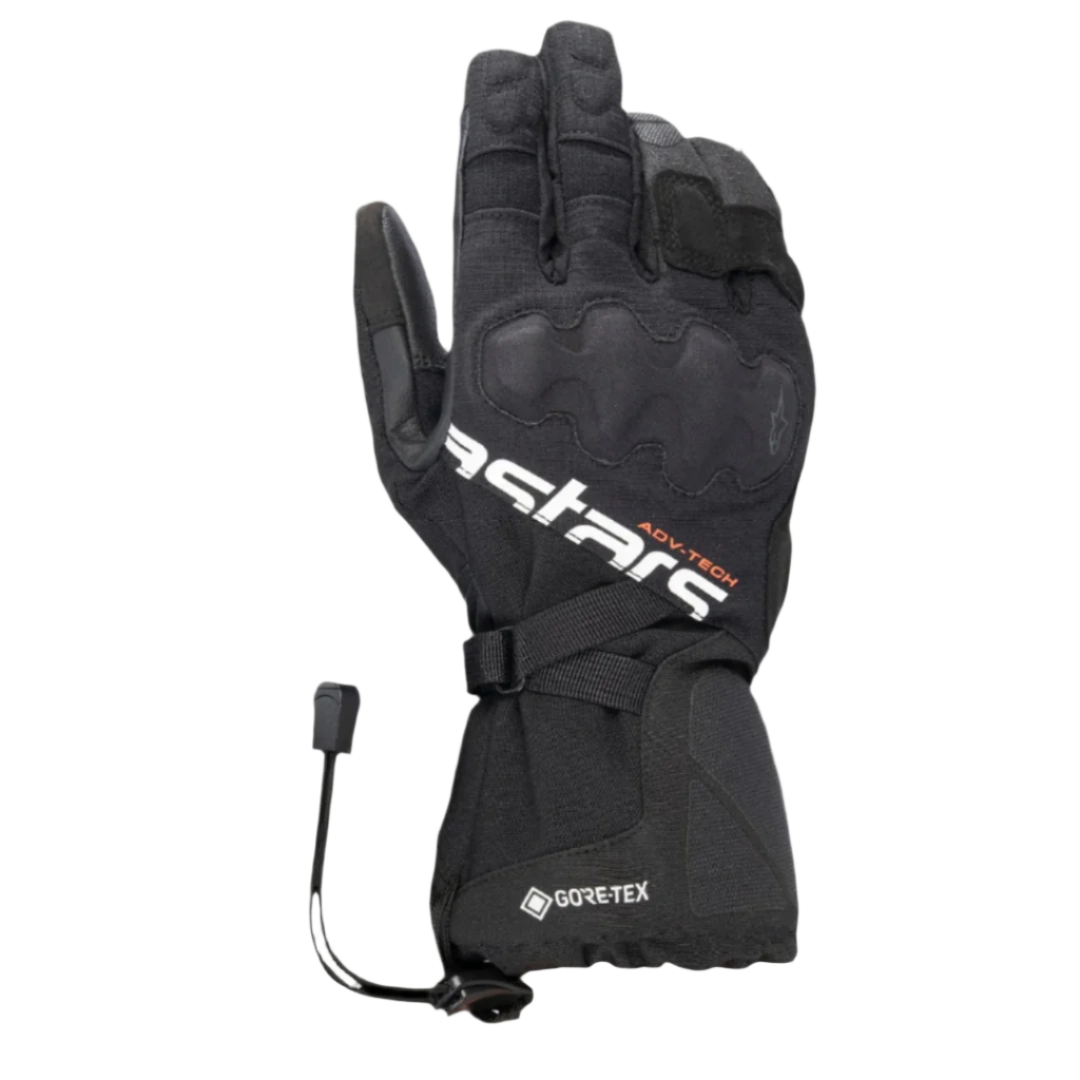 Gants Alpinestars XT-5 GORE-TEX, gants de moto noirs, avec logo Astars blanc et inscription ADV-TECH orange, manchette longue avec protection des articulations recouverte, logo GORE-TEX et fermeture par cordon élastique, équipement de touring aventure
