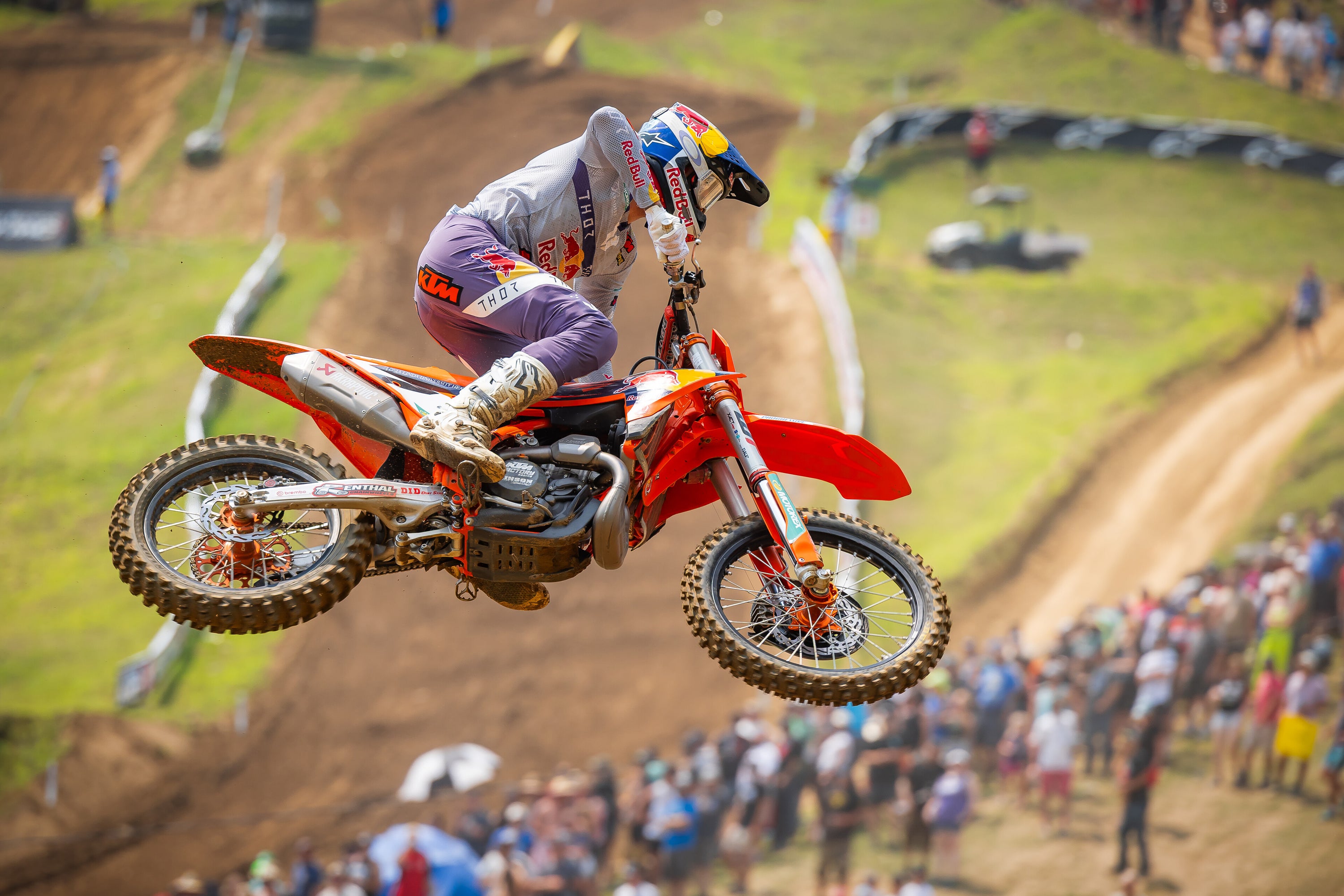 Aaron Plessinger performing a stunt on his mx bike while wearing Alpinestars clothing and protections