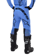Alpinestars 2024 Supertech Dade Pants, Motocross Pants, Light Blue, rear view showing large black branding on the seat and legs, worn with black Alpinestars Tech 10 boots, athletic race fit for professional off-road performance.