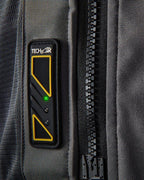 Affichage Led Alpinestars Tech-Air 5 sur gilet textile gris foncé, voyant vert et fermeture éclair noire.