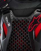 Tech-Air® Off-Road System detail featuring black honeycomb Nucleon CELL protection and red Alpinestars branding.