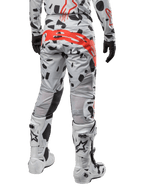Alpinestars 2024 Techstar Rantera Pants, Motocross Pants, Haze Gray Camo, featuring black camo patterns and a large red Alpinestars logo on the seat, rear view worn with white boots and matching racing gear